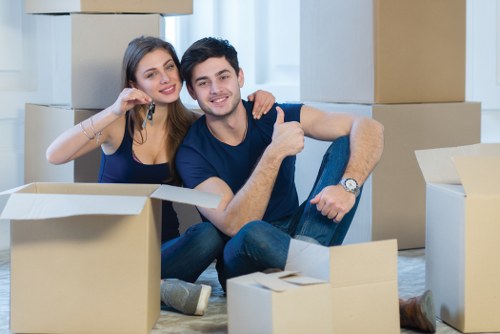 Professional house removalists packing boxes in a Fulham home