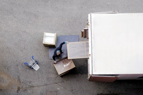 Prepared moving checklist and packed boxes in a Fulham living room
