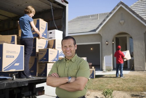 Team preparing a removal van with safety in mind