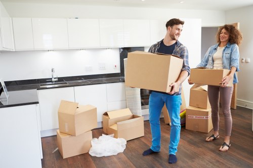Removal staff securing items inside a van