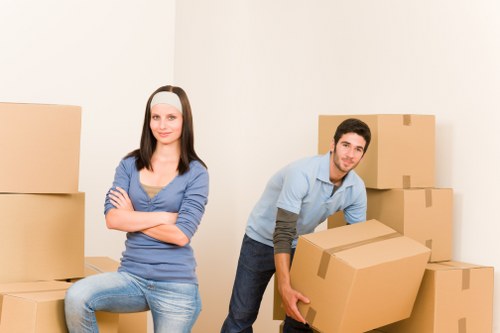 Man with van service loading donated furniture for charity reuse