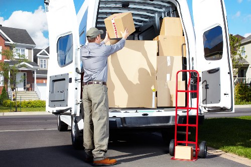 Packed moving boxes and furniture arranged for transport