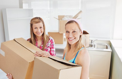 Packed boxes and furniture ready for a house move in Fulham