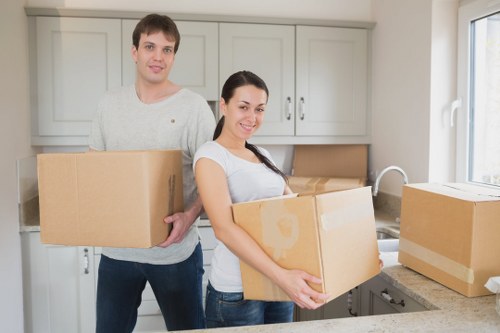 Professional office movers organising workstations for relocation